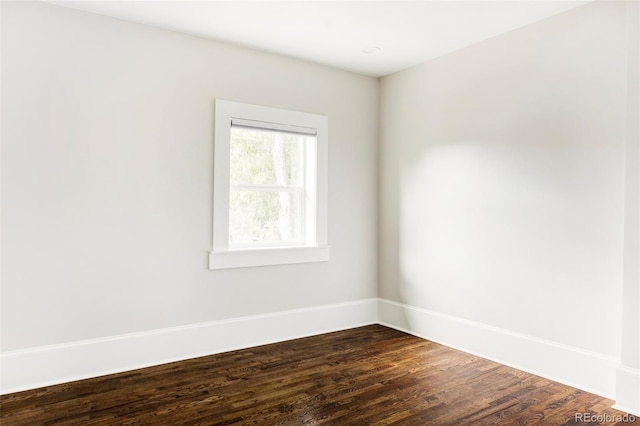 spare room with hardwood / wood-style floors