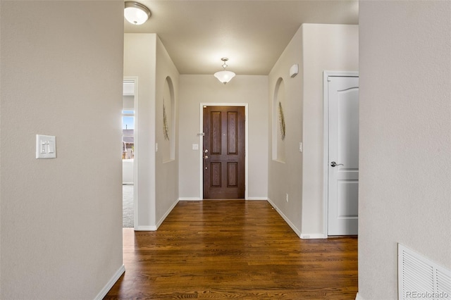 entryway featuring dark wood-type flooring