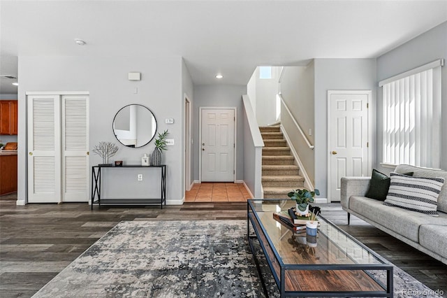 living room featuring stairway, recessed lighting, baseboards, and wood finished floors