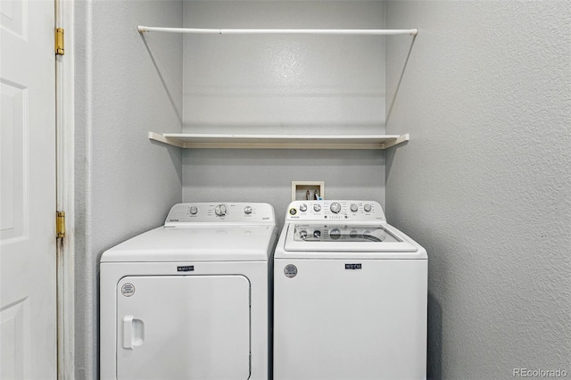 laundry area with separate washer and dryer and laundry area