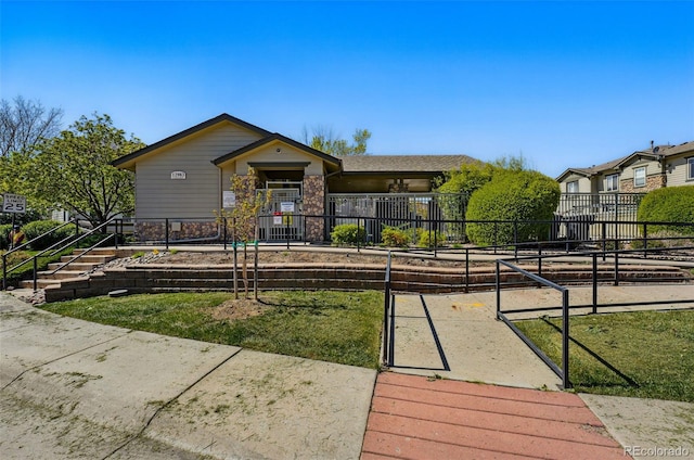 view of home's community featuring a fenced front yard