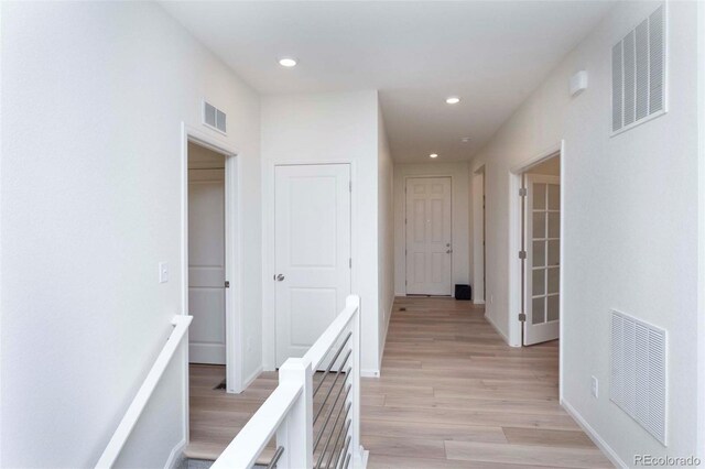 hall with light wood-type flooring