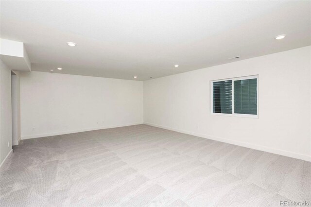 empty room featuring light colored carpet