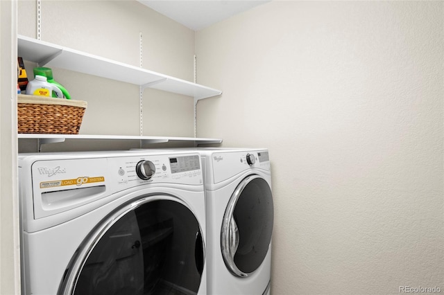 washroom featuring washer and dryer