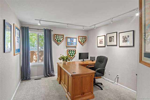 office area featuring light carpet and rail lighting