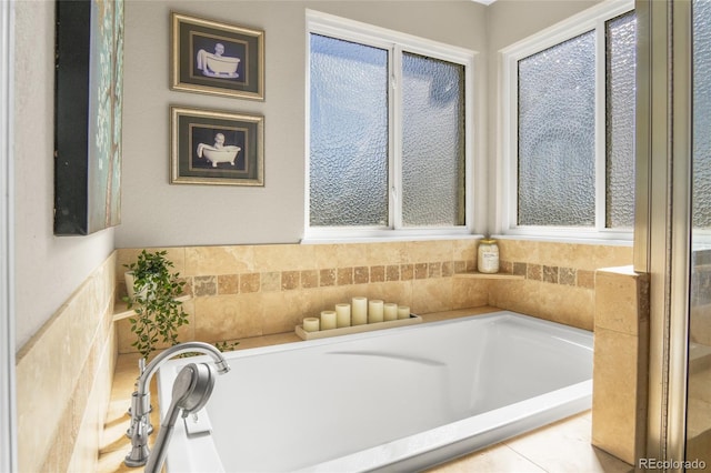 bathroom featuring tiled bath