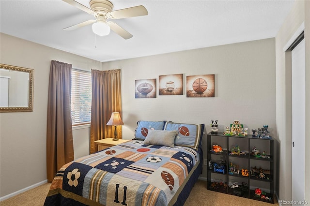 carpeted bedroom featuring ceiling fan and a closet