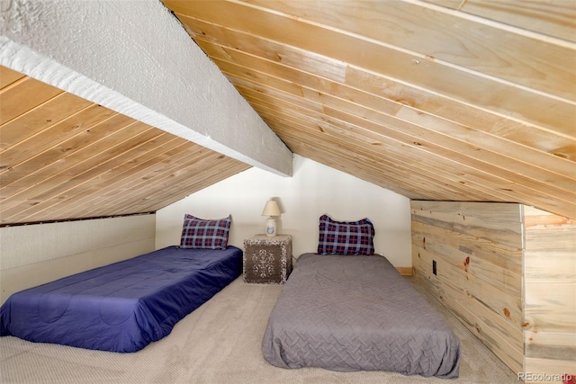 carpeted bedroom with lofted ceiling with beams