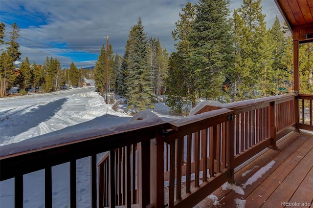 view of snow covered deck