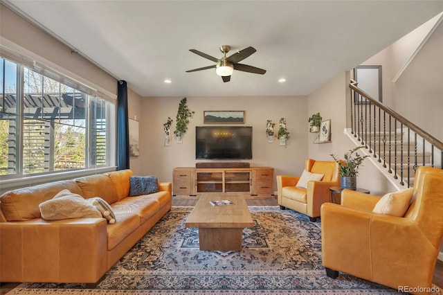 living area featuring ceiling fan, recessed lighting, and stairs