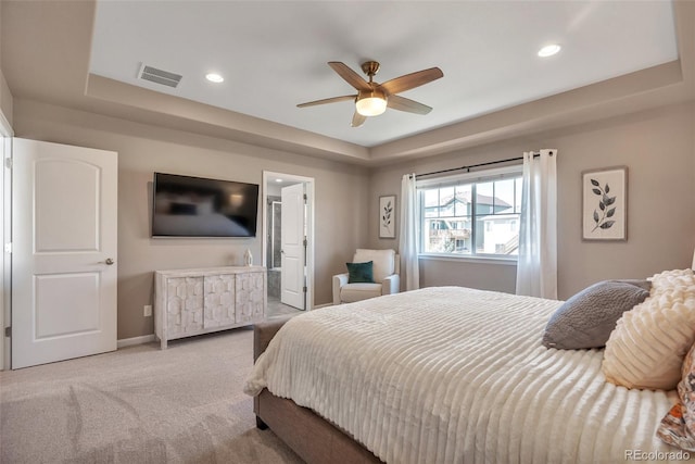 bedroom featuring a raised ceiling, carpet, baseboards, recessed lighting, and ceiling fan