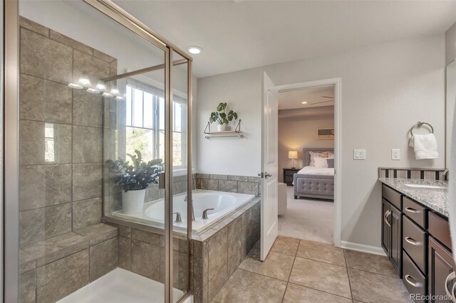 bathroom featuring tile patterned floors, a garden tub, ensuite bathroom, a stall shower, and vanity