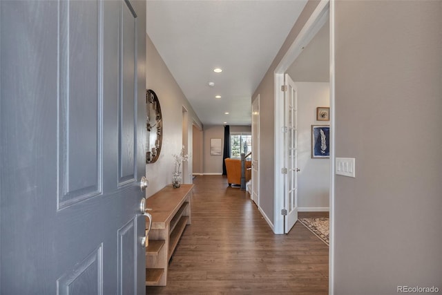 entrance foyer with wood finished floors, recessed lighting, baseboards, and french doors