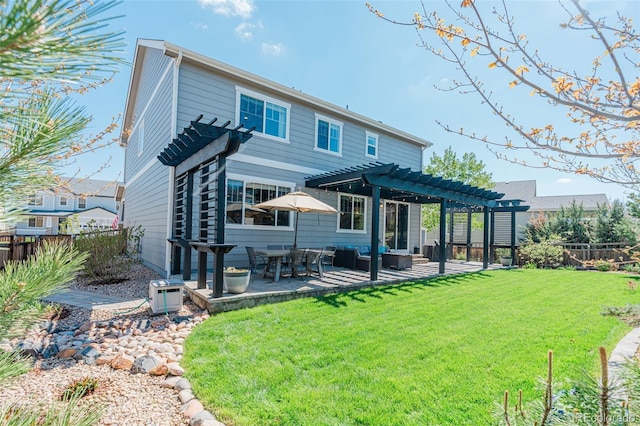 rear view of property featuring a pergola and a patio