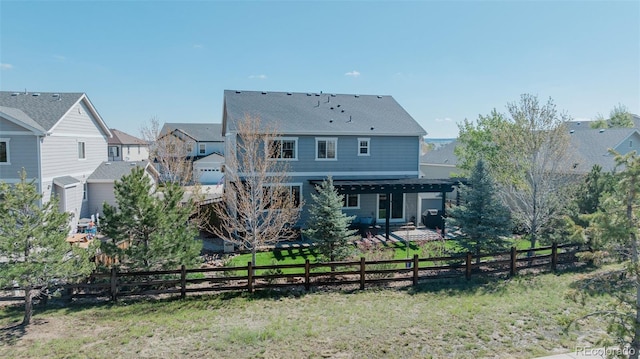 back of property featuring a patio and a residential view