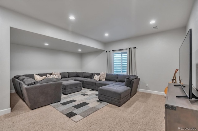 living area featuring light colored carpet, baseboards, and recessed lighting