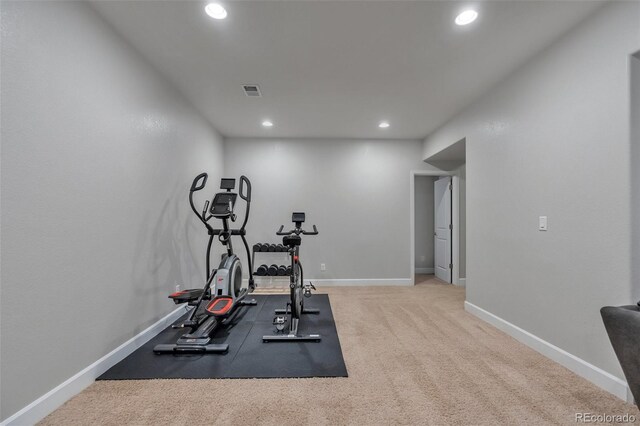 exercise area featuring recessed lighting, baseboards, and carpet