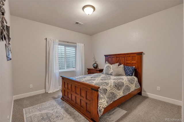 bedroom with carpet and baseboards