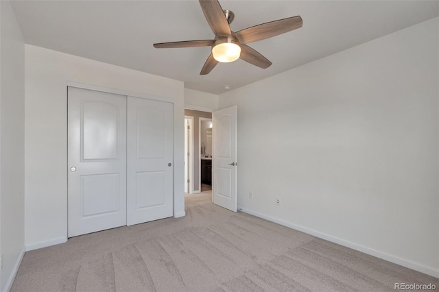 7665 Grady Cir, Castle Rock, CO 80108 - unfurnished bedroom featuring baseboards, light colored carpet, a closet, and a ceiling fan