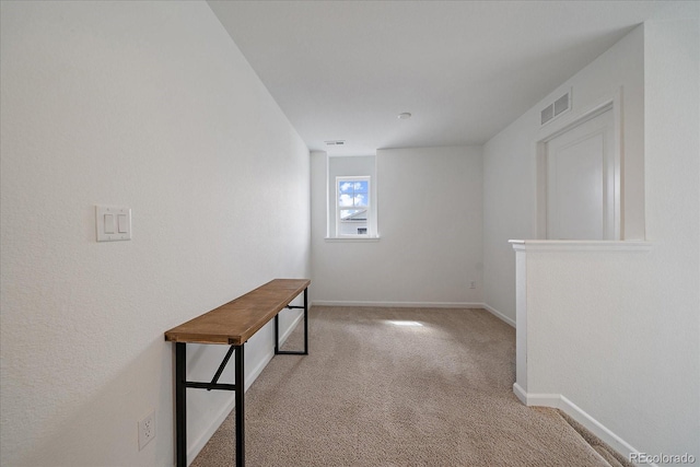interior space featuring baseboards and visible vents