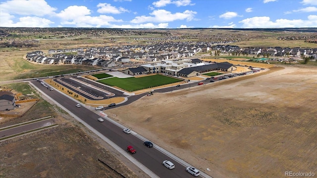 birds eye view of property with a residential view