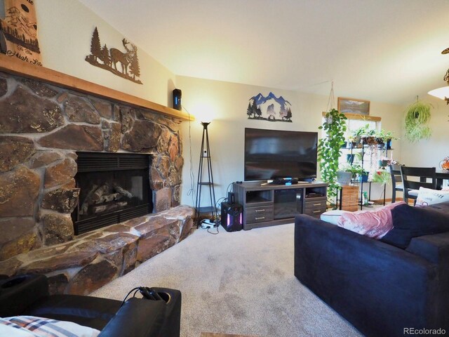 living room featuring a fireplace and carpet floors