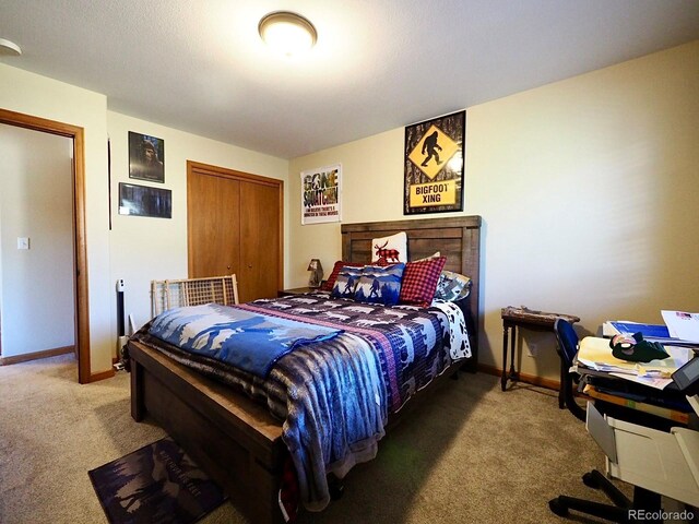 carpeted bedroom with a closet