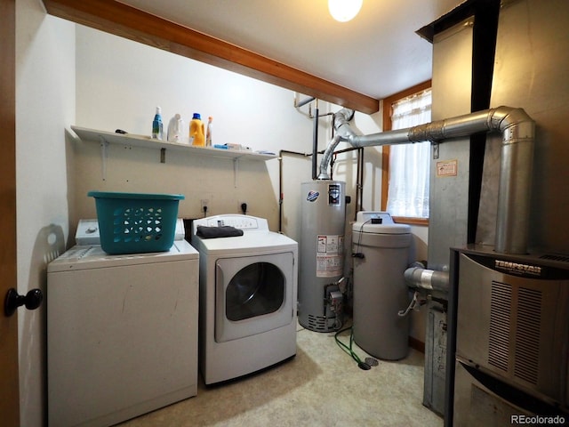 laundry area with gas water heater, light carpet, and washer and dryer