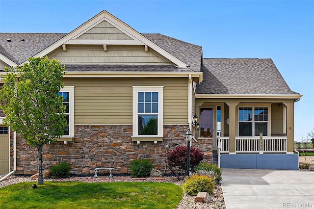 7426 E 148th Pl, Thornton, CO 80602 - craftsman house featuring a porch, stone siding, and roof with shingles