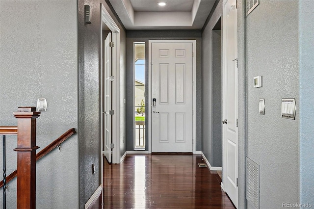 7426 E 148th Pl, Thornton, CO 80602 - entrance foyer with a textured wall, wood finished floors, baseboards, and a tray ceiling