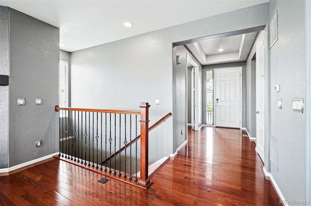 7426 E 148th Pl, Thornton, CO 80602 - entrance foyer featuring wood finished floors, a textured wall, baseboards, and recessed lighting