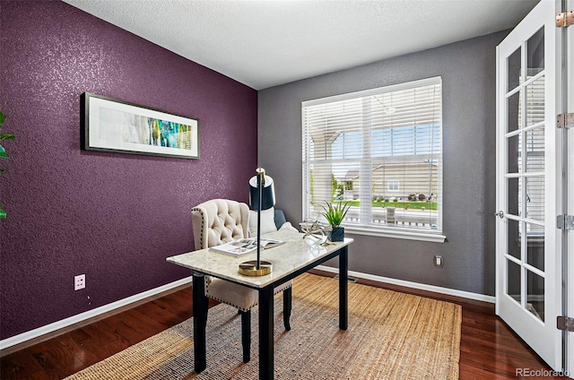 7426 E 148th Pl, Thornton, CO 80602 - home office with wood finished floors, a textured wall, french doors, and baseboards