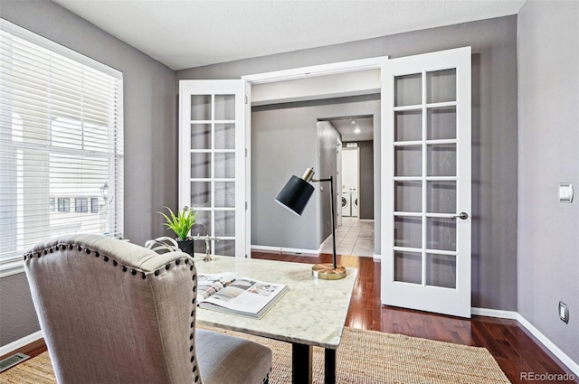 7426 E 148th Pl, Thornton, CO 80602 - dining space with baseboards, wood finished floors, and french doors