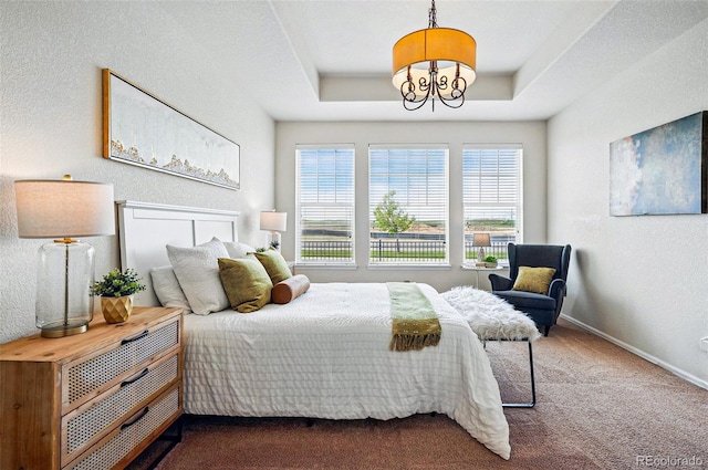 7426 E 148th Pl, Thornton, CO 80602 - bedroom with a chandelier, carpet floors, baseboards, a textured wall, and a tray ceiling