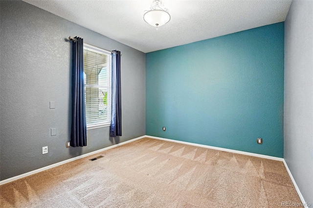 7426 E 148th Pl, Thornton, CO 80602 - empty room featuring carpet, a textured wall, baseboards, and a textured ceiling