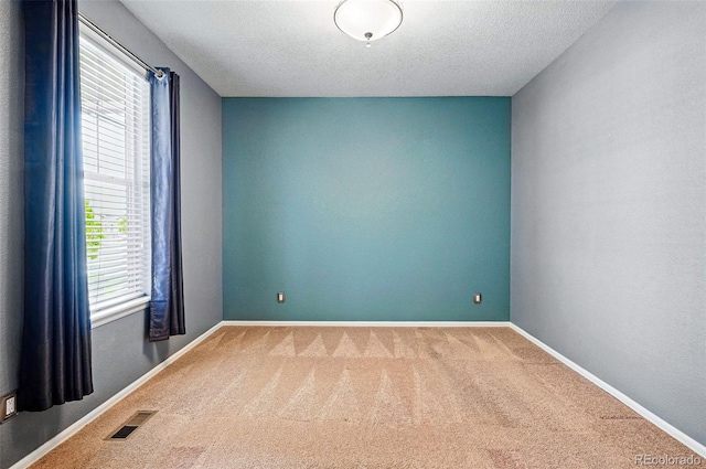 7426 E 148th Pl, Thornton, CO 80602 - carpeted spare room with baseboards and a textured ceiling