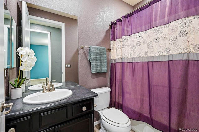 7426 E 148th Pl, Thornton, CO 80602 - full bathroom with vanity, toilet, a textured wall, and a shower with curtain