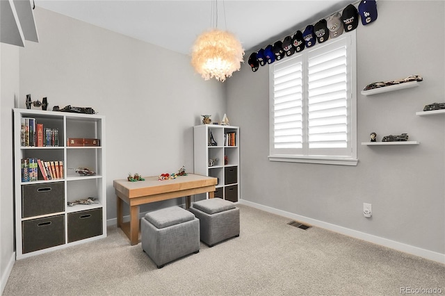 interior space with visible vents, carpet, and baseboards