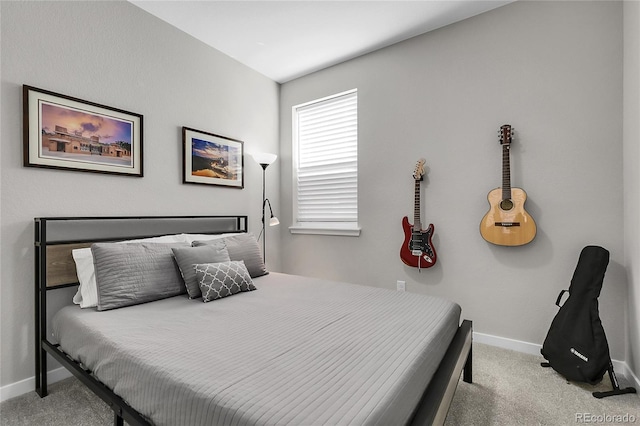 carpeted bedroom featuring baseboards