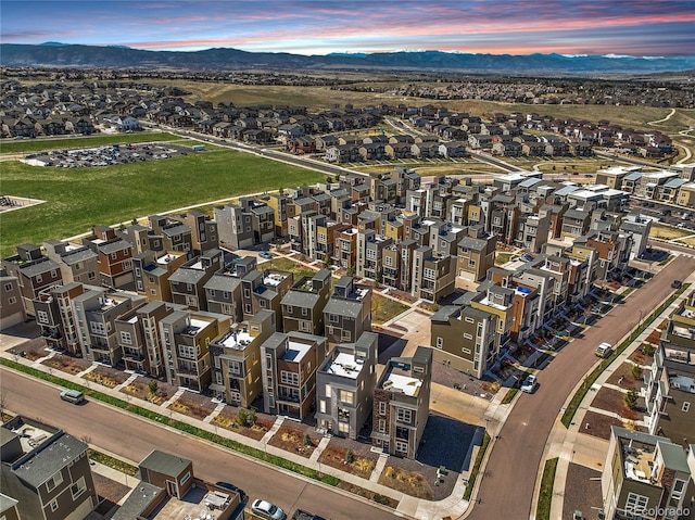 drone / aerial view featuring a residential view and a mountain view