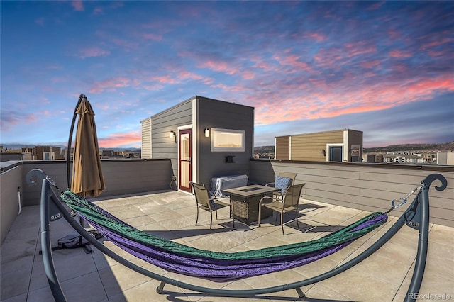 patio terrace at dusk with a fire pit