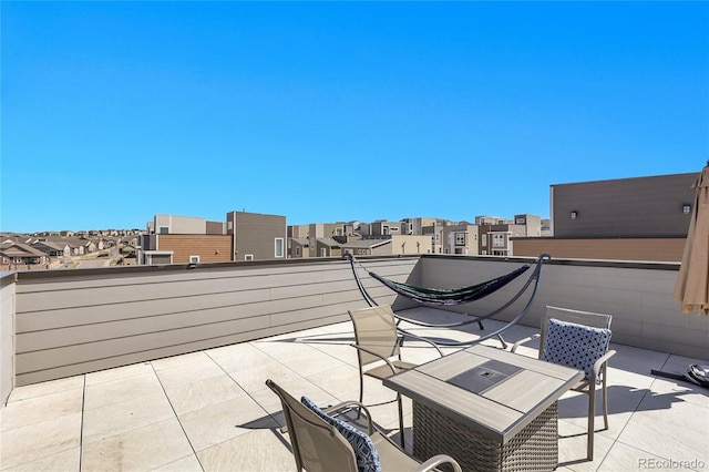 view of patio with a balcony and a residential view