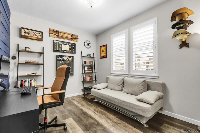 sitting room featuring baseboards and dark wood-style floors