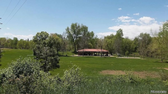 surrounding community featuring a rural view and a lawn