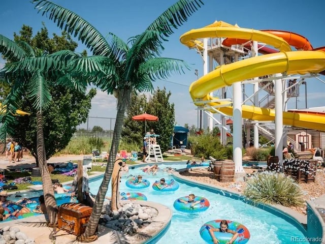 view of pool with a water slide