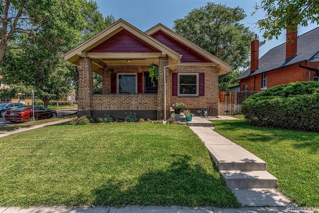 bungalow with a front yard