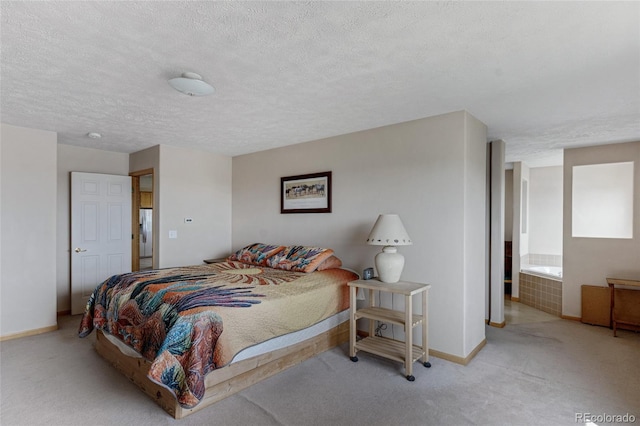 bedroom featuring carpet floors, baseboards, and a textured ceiling
