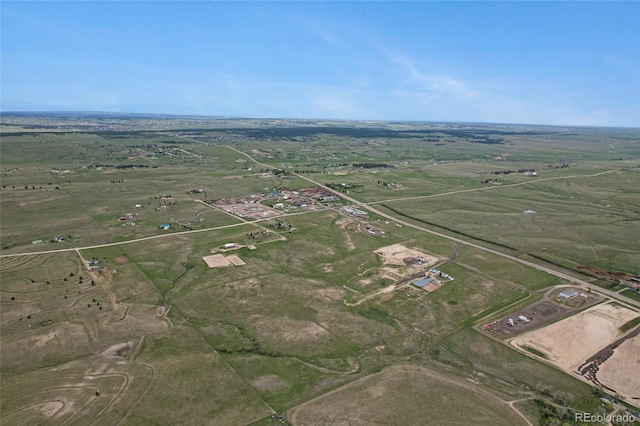 aerial view of property and surrounding area featuring rural landscape