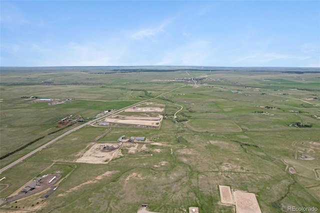 aerial view of property and surrounding area featuring rural landscape