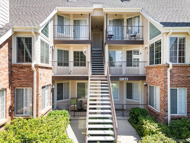 13873 E Lehigh Ave Unit E, Aurora, CO 80014 - view of building exterior with stairs